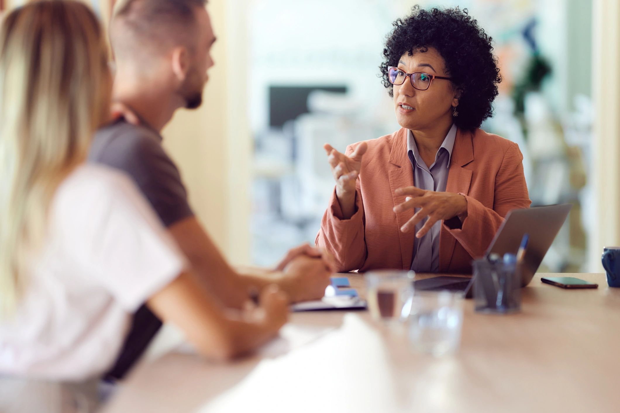 Real estate agent meeting clients in an office