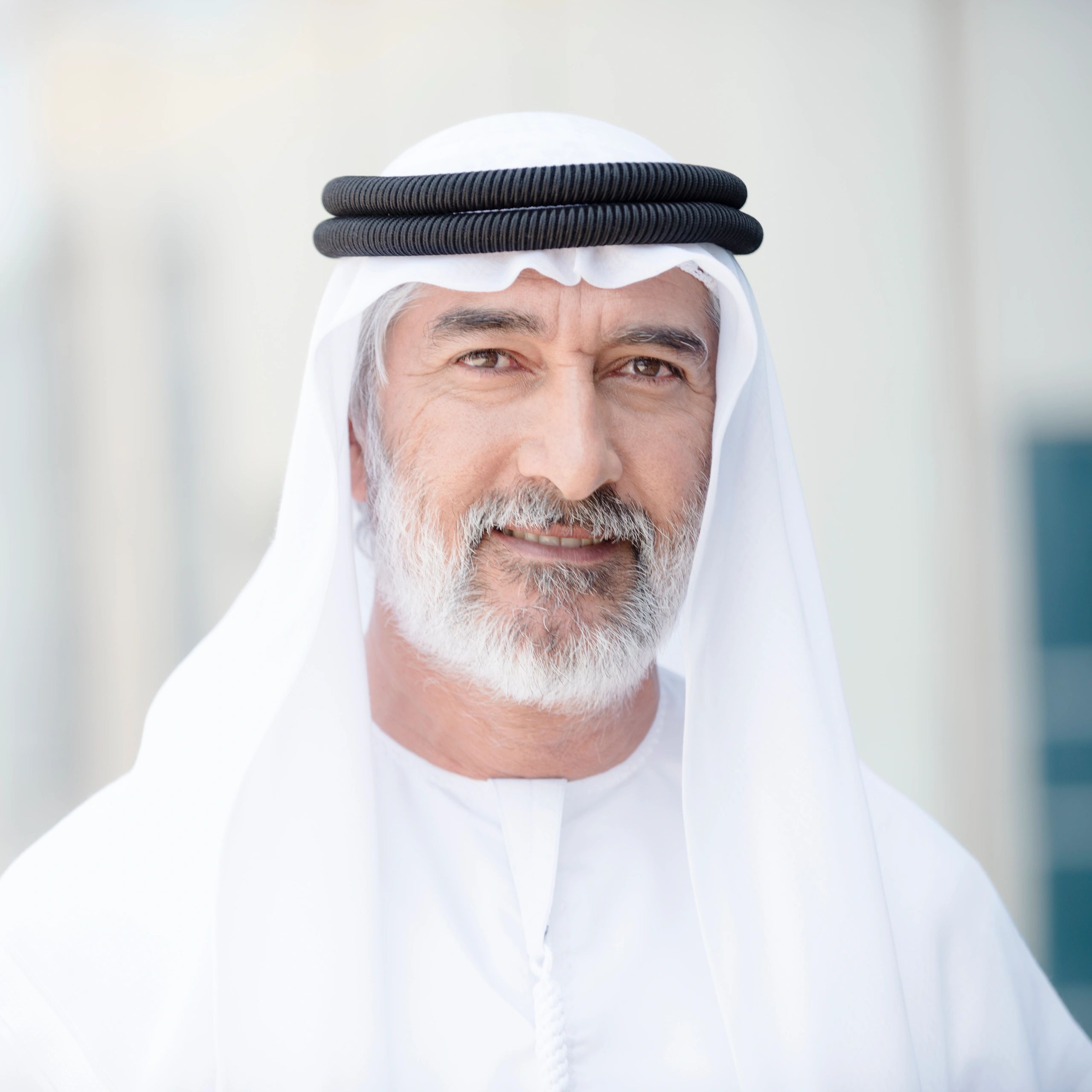 Headshot of a professional man in traditional attire